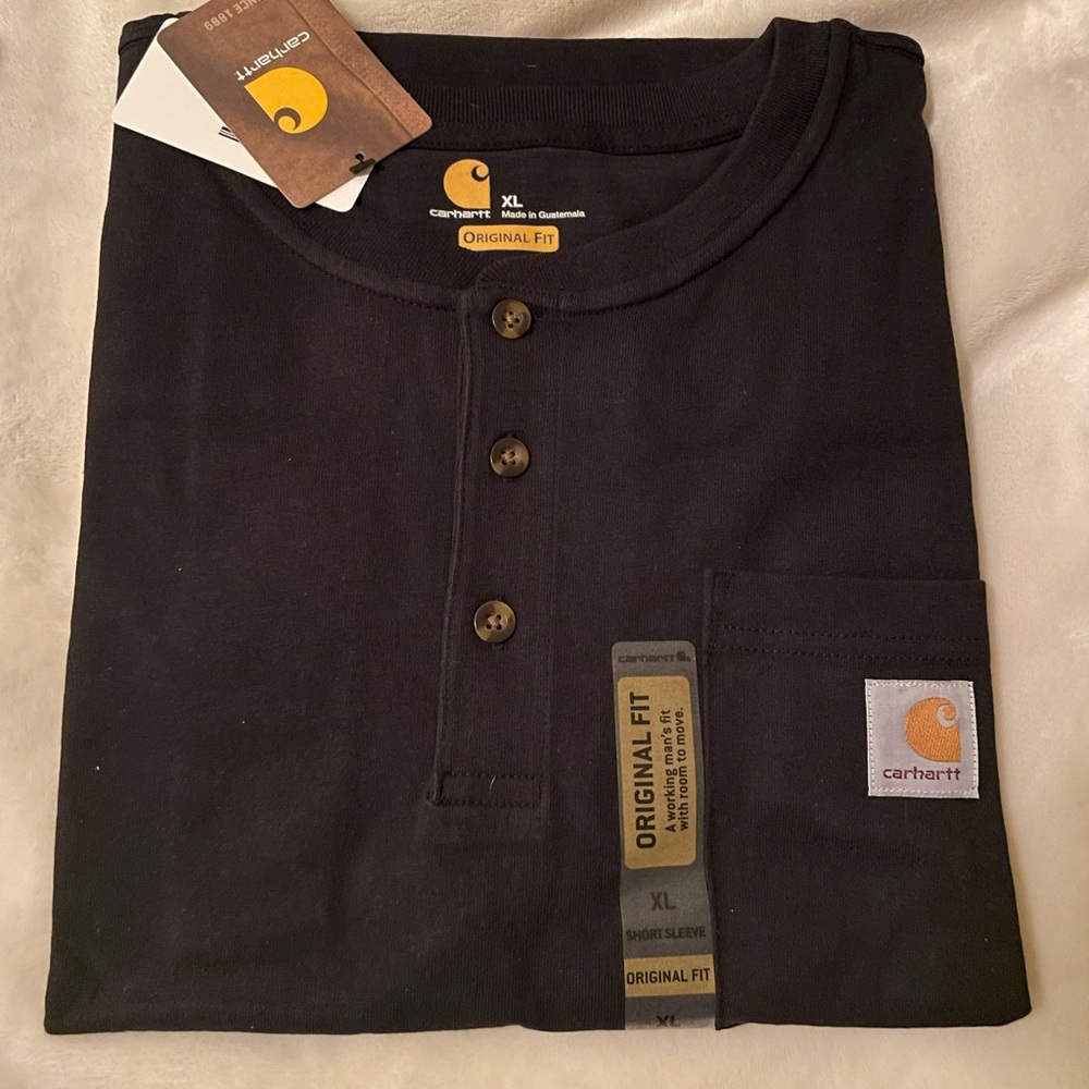 Never been worn. Carhartt original fit long sleeve work shirts.